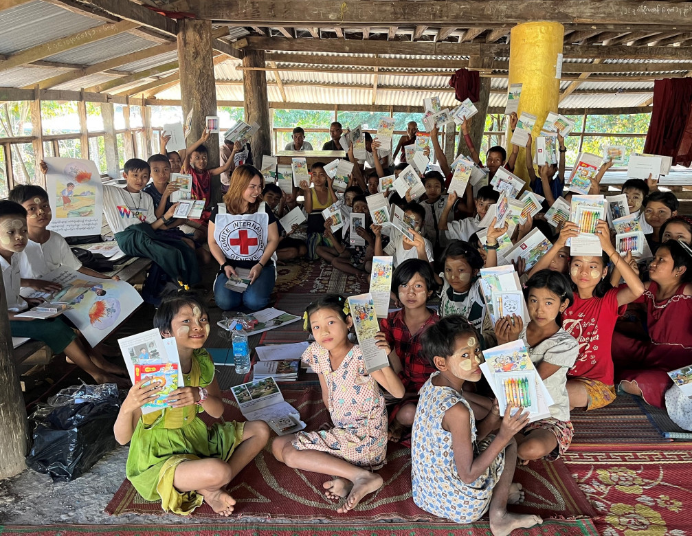 Children learn about the risk of unexploded ordnance at an awareness session in Mrauk-U Township.