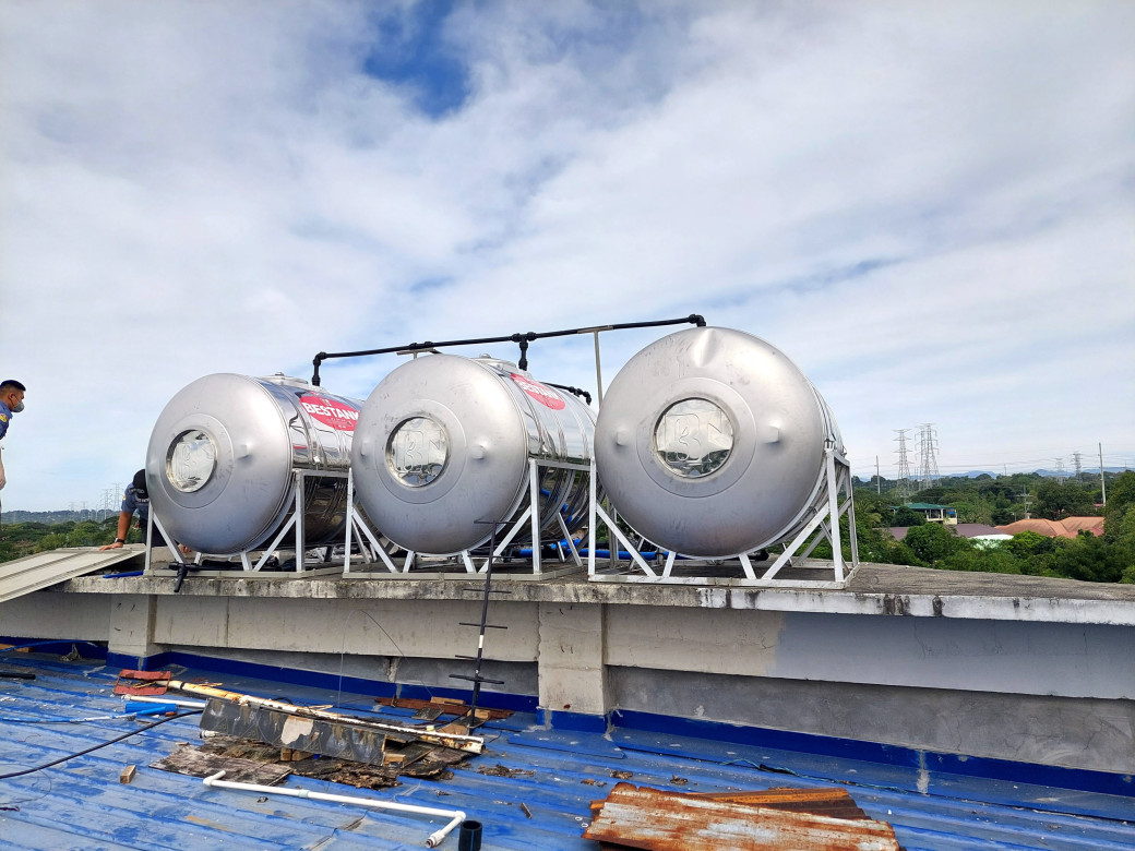 The newly installed water tanks on the roof deck of the jail. 