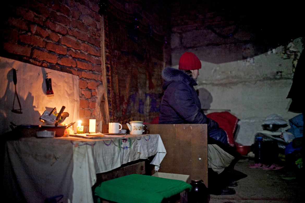 Donetsk, Ukraine, January 2015. A basement where people are living on the outskirts of the city, some 5 km from the ruined airport, as continuous shelling pounds the area. These people have had no electricity or running water for the last two weeks.
