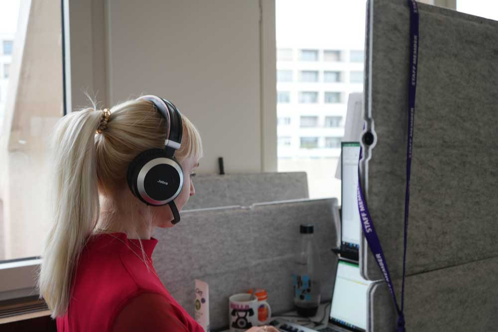 This is a call operator at the Central Tracing Agency Bureau for the international armed conflict between Russia and Ukraine. She, and many other call operators, receives calls from families looking for missing loved ones, or of people held as prisoners of war. She also contacts families with news of their family members.