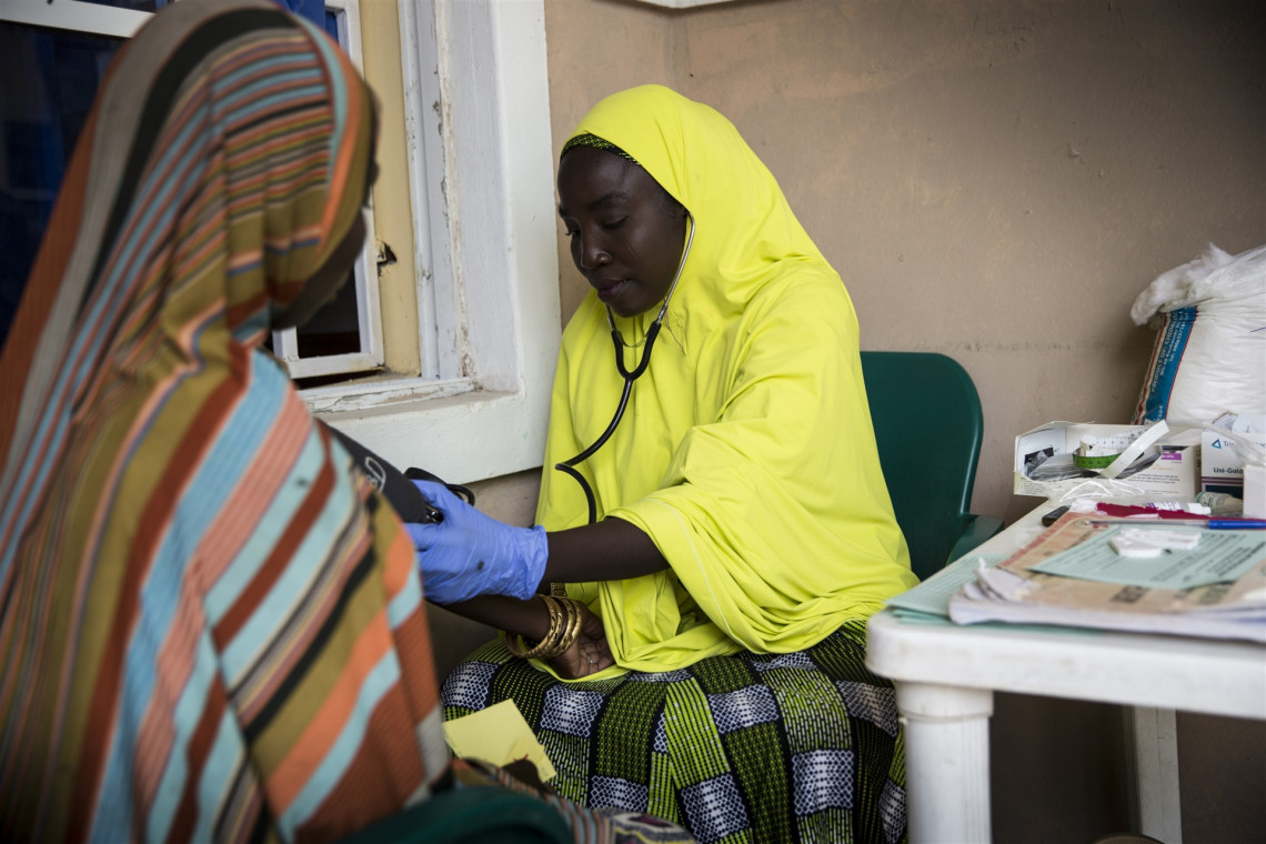 Borno State, town of Monguno. A woman receives a checkup at the maternal health section of a primary health clinic supported by the ICRC.